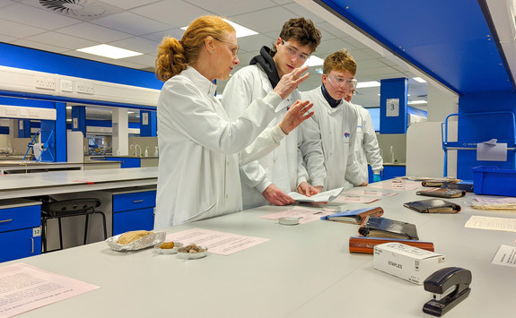 Scientists and teacher in a lab